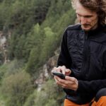 HIker making phone payment