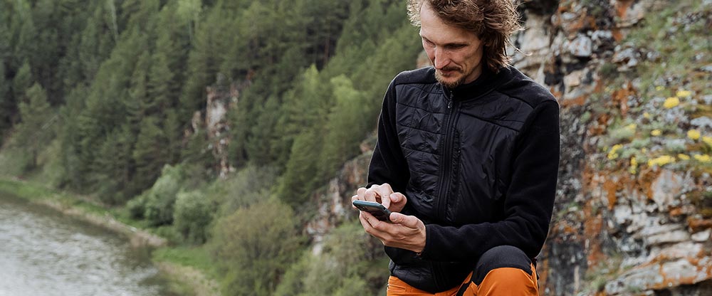 HIker making phone payment