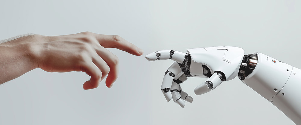 Human hand making contact with robot hand.